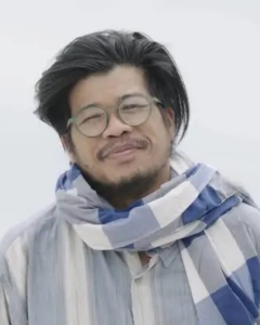 KinnPorsche The Series Thai BL Drama and it’s a simple graphic or photograph of director Khom Kongkiat Khomsiri